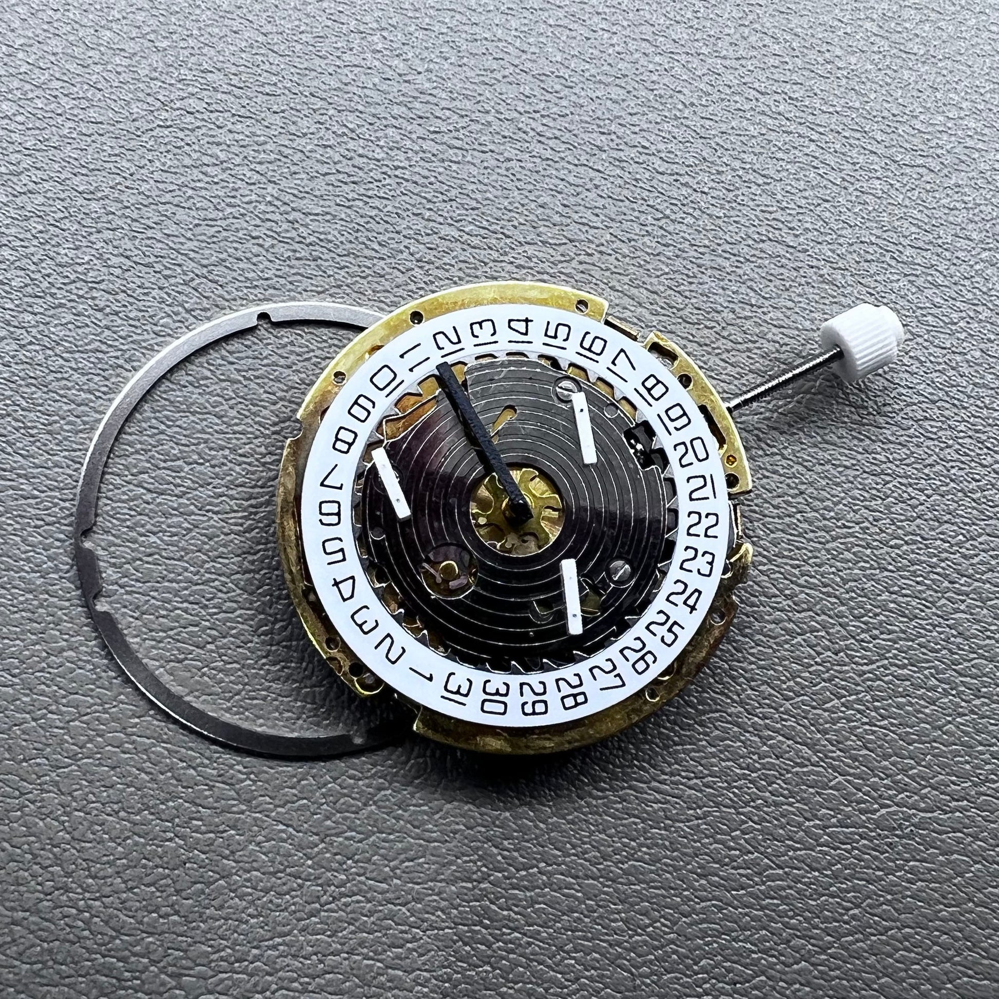 Swiss ISA 8171 golden quartz watch movement with date at 4 o'clock, multi-function design by Swiss ISA.