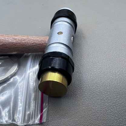 Swiss Tool Bergeon 30417 hammer with replaceable brass and synthetic ends for delicate watch repair tasks.