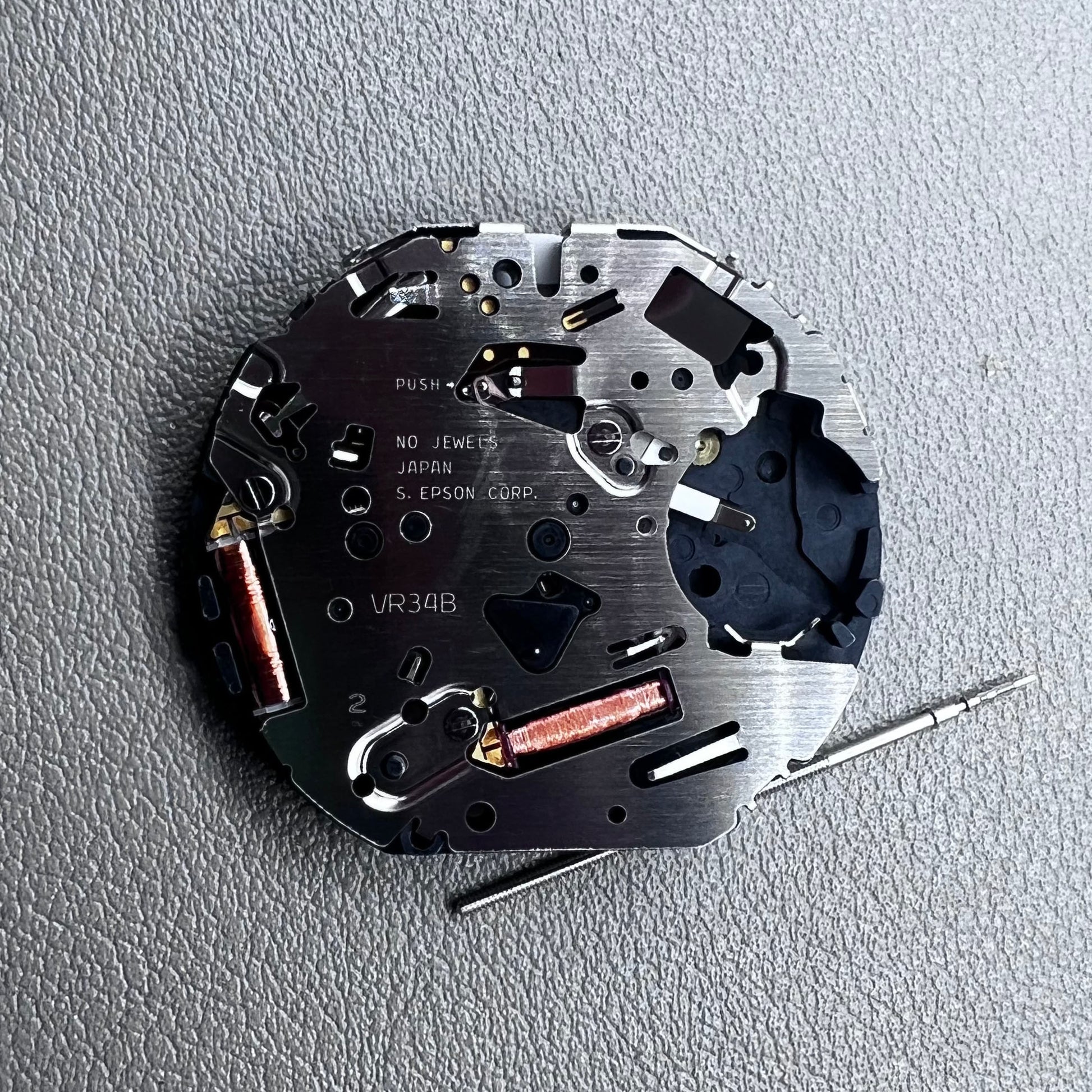 Japan Hattori Epson TMI VR34 quartz watch movement for precise timekeeping in accessories.
