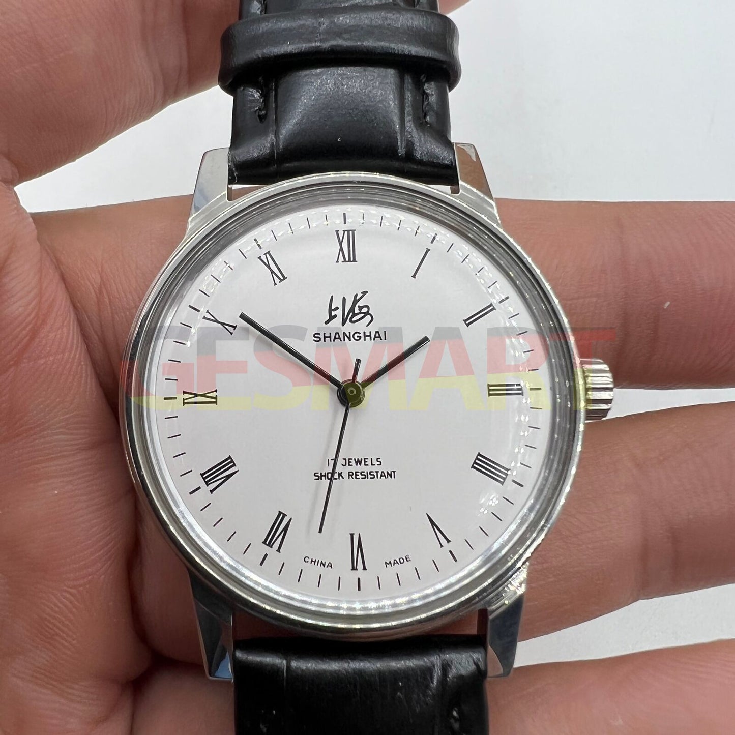 Shanghai Factory 36mm manual mechanical watch with shock-resistant 17-jewel movement and classic stainless steel case.