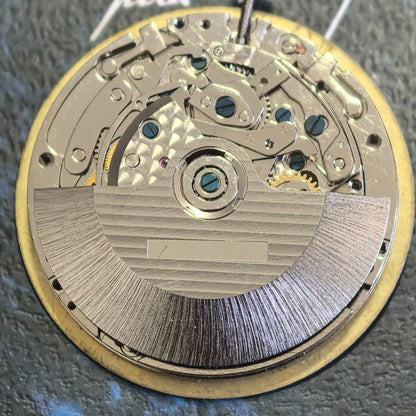 Chinese Dandong 7750 watch movement with date at 3 and small seconds at 6,9,12 positions for precise timekeeping.