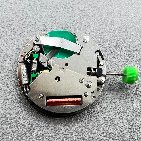 Swiss ISA 1198 quartz watch movement with day, date, and moon phase features for precise timekeeping.