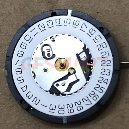 ISA 2320 white dial quartz watch movement with date at 3, Watchmaker repair part for precision timing.