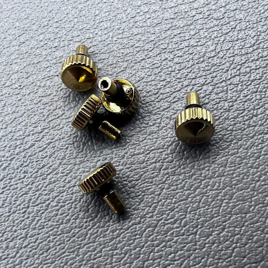 Set of 5 golden watch crowns compatible with Orient watch movements, ideal for stylish repairs.