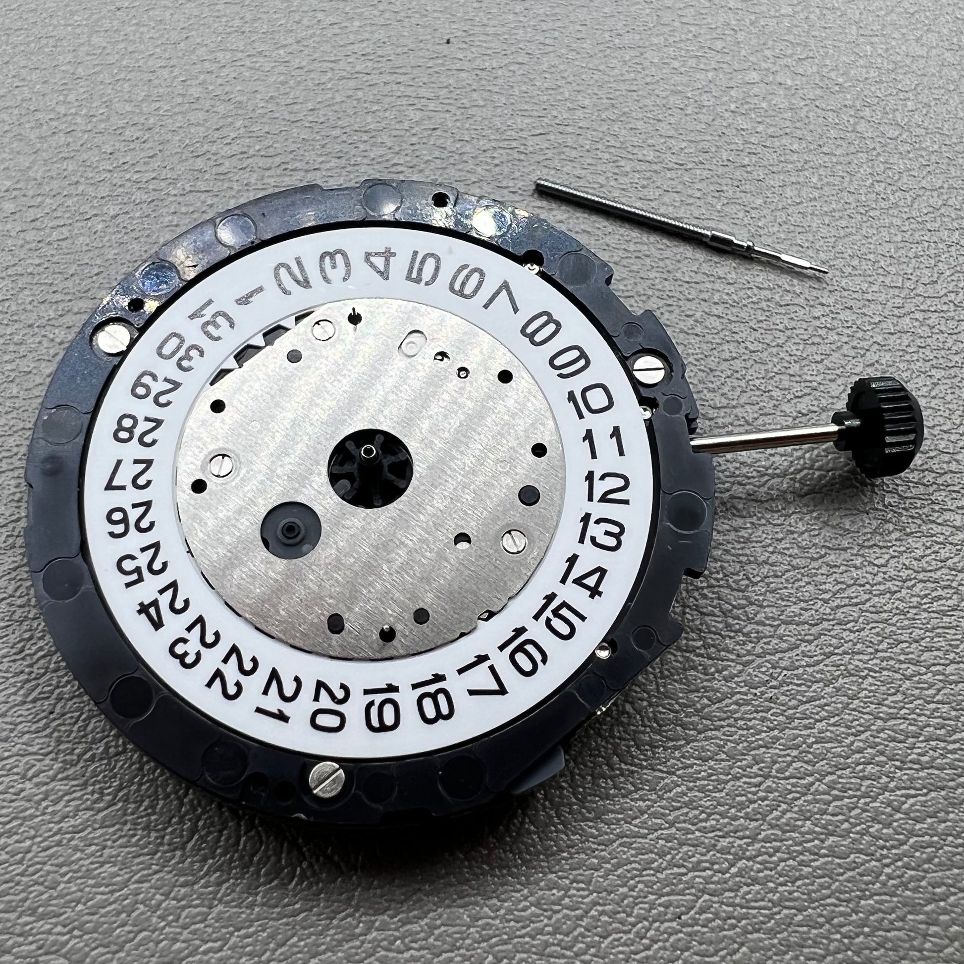 Japan Miyota 6S11 quartz watch movement featuring 2 hands, date at 3, small seconds at 6 and 12 positions.