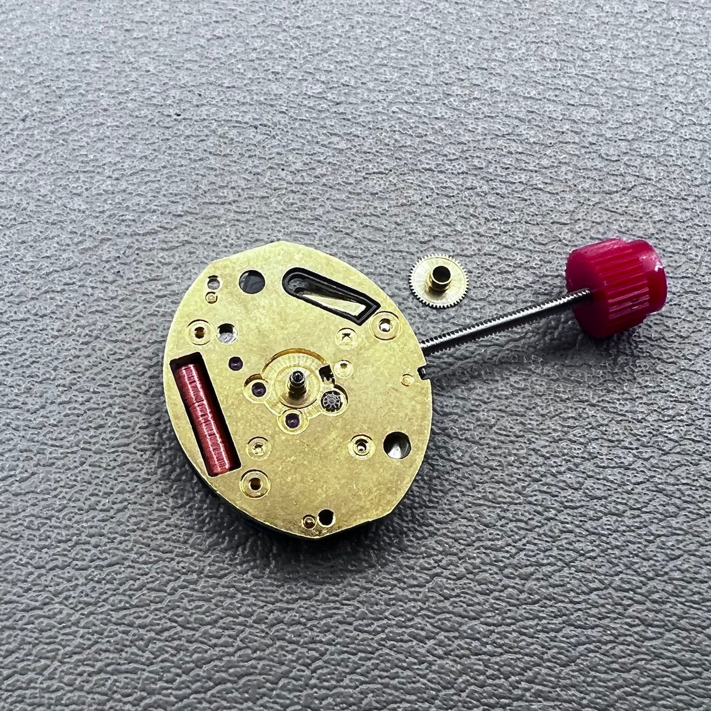 Close-up of Swiss ETA 980.103 quartz watch movement showcasing precision engineering and reliability.