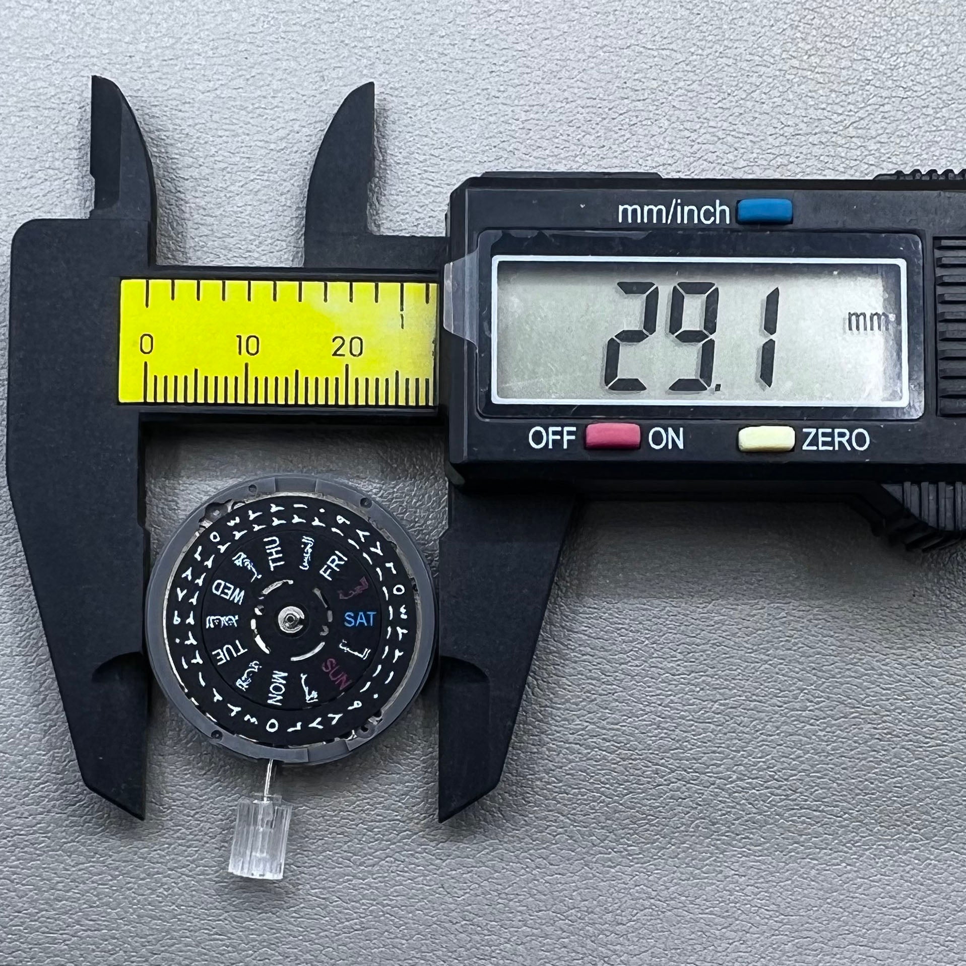 Seiko NH36 watch movement with black dial, Arabic numerals, date display, crown at 3:00 position