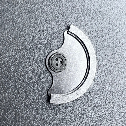 Silver rotor oscillating weight for Miyota 9015 mechanical watch movement, enhancing winding efficiency.