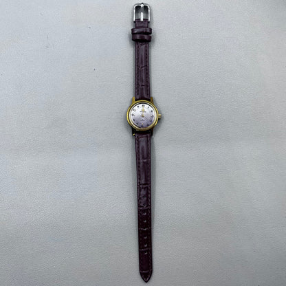 Dark Brown Strap Round Case 3 Hands Purple Background Manual Mechanical Watch