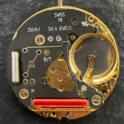 Swiss Made ETA 256.041 quartz watch movement with black dial and date display at 6 o'clock.