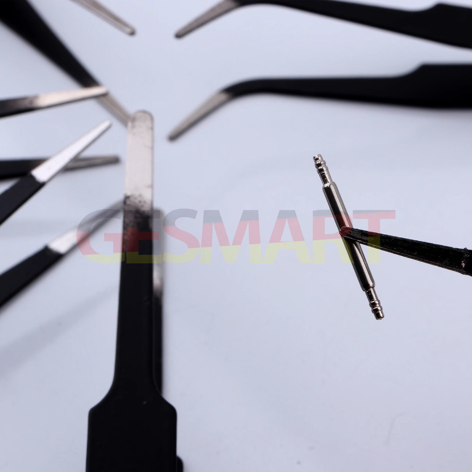 Set of 6 black-plated stainless steel anti-static tweezers in PVC bag for watch and jewelry repair.