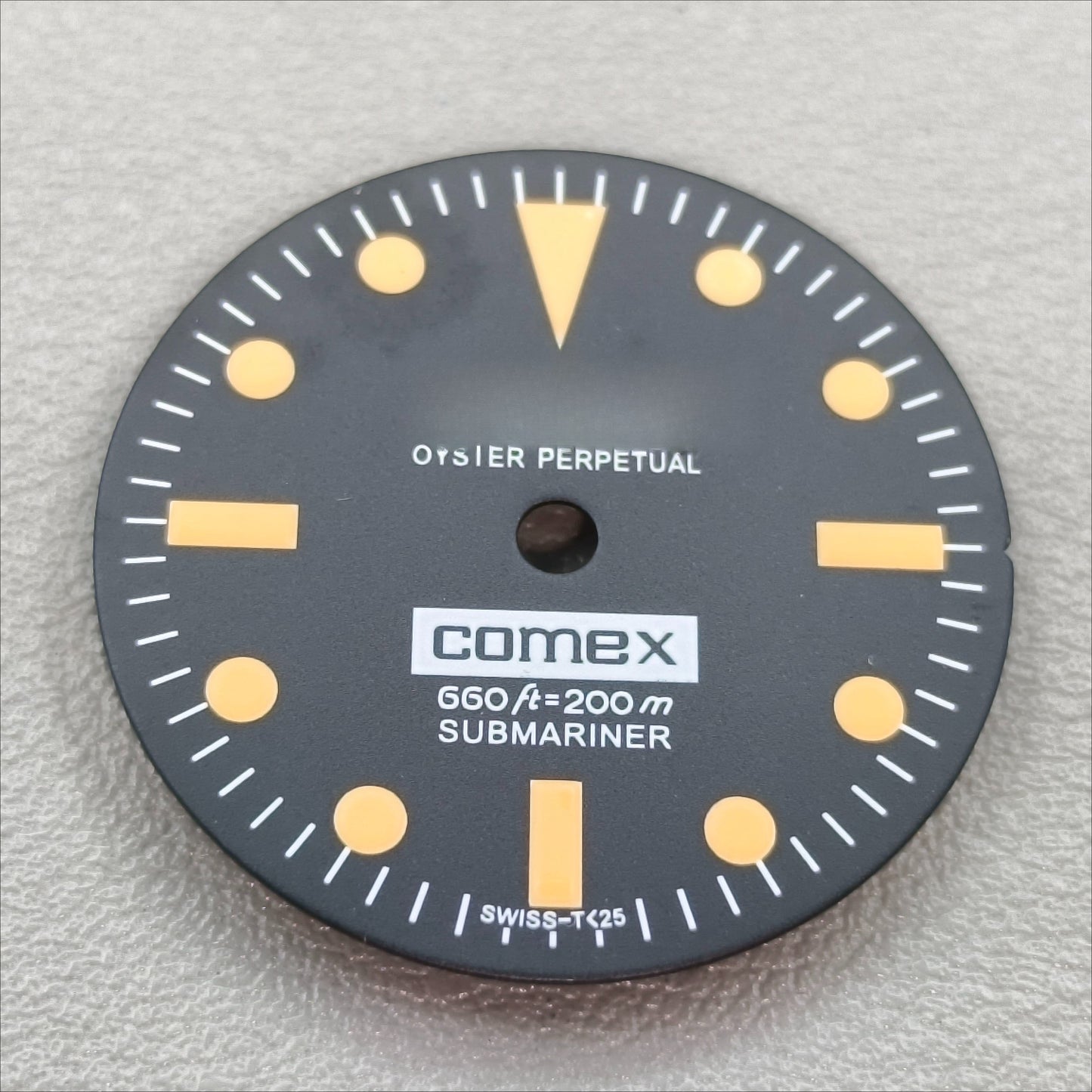 watch dial with R logo