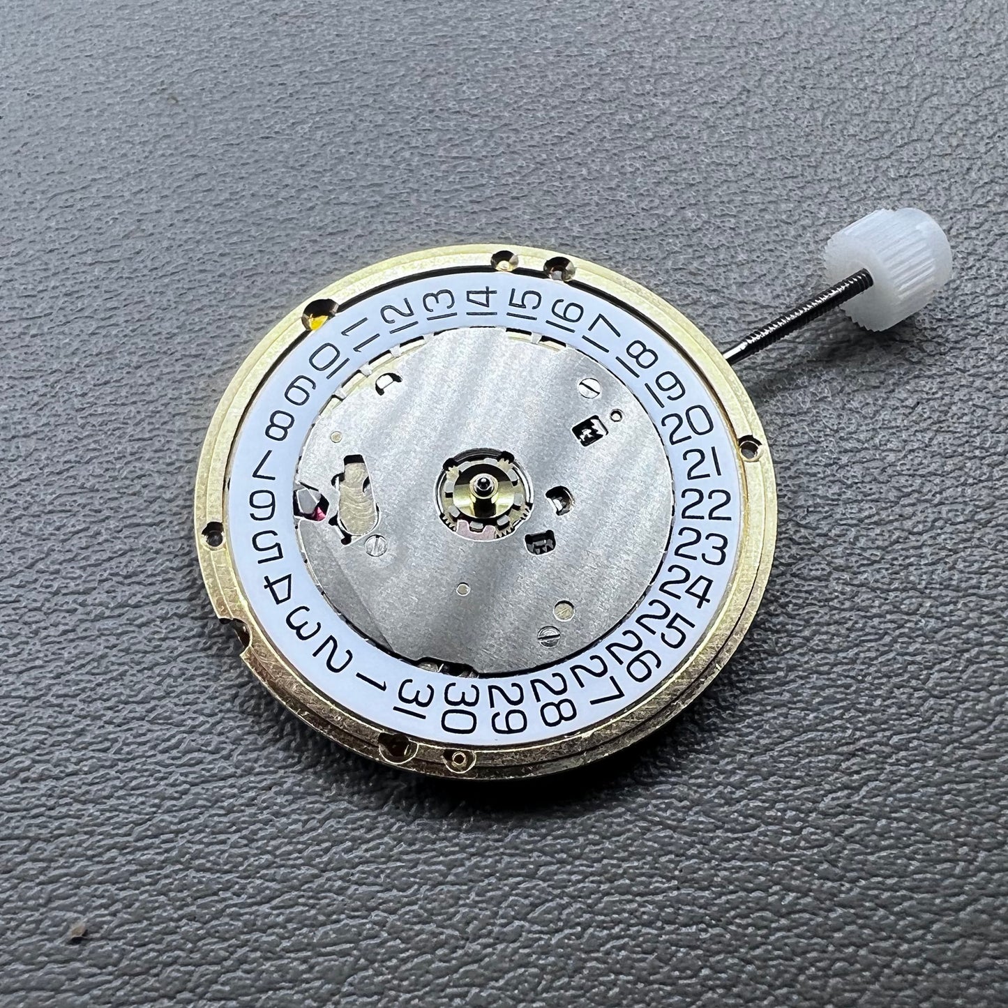 Swiss ETA E63.111 quartz watch movement with 3 hands and date display at 3 o?clock for precise timekeeping.