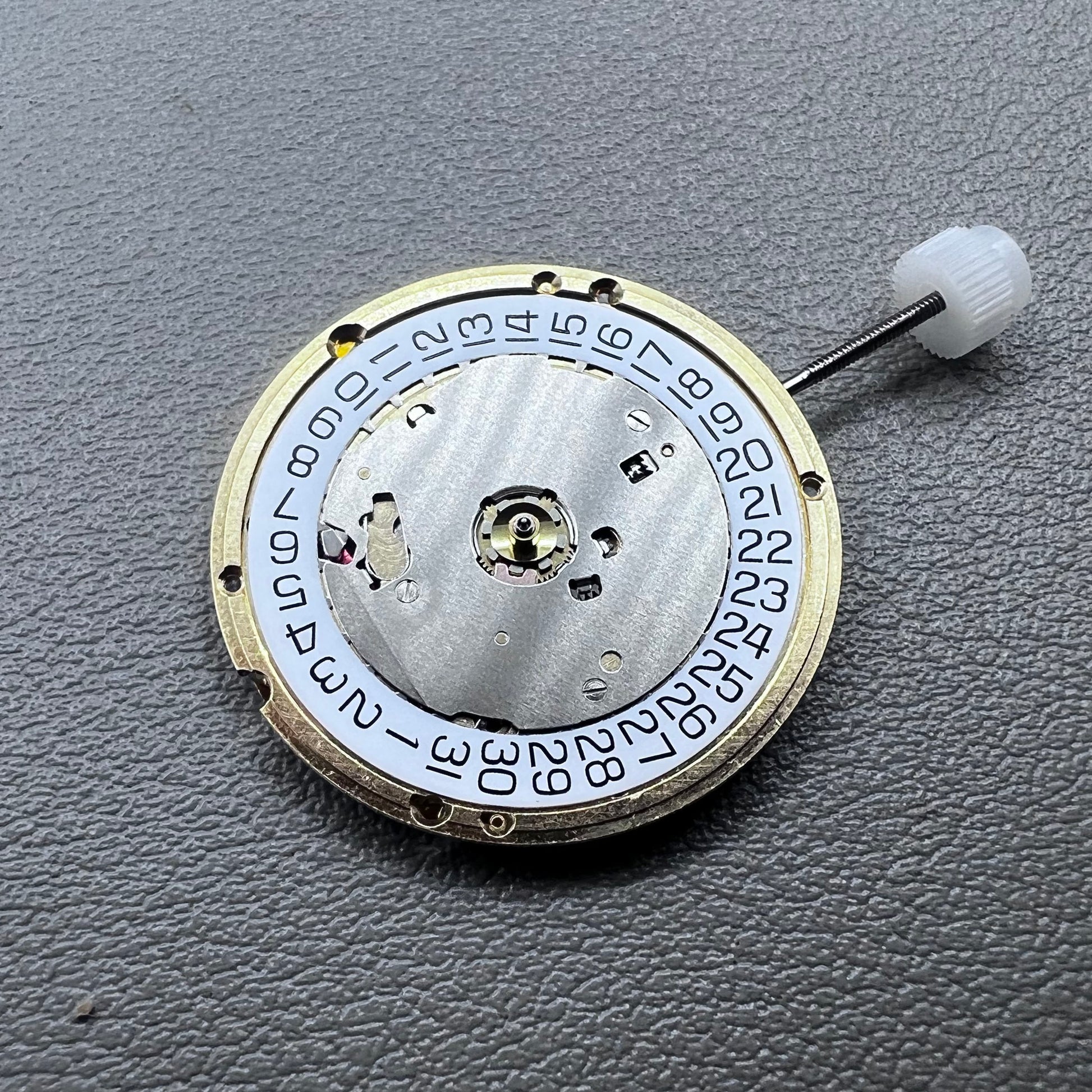 Swiss ETA E63.111 quartz watch movement with 3 hands and date display at 3 o?clock for precise timekeeping.