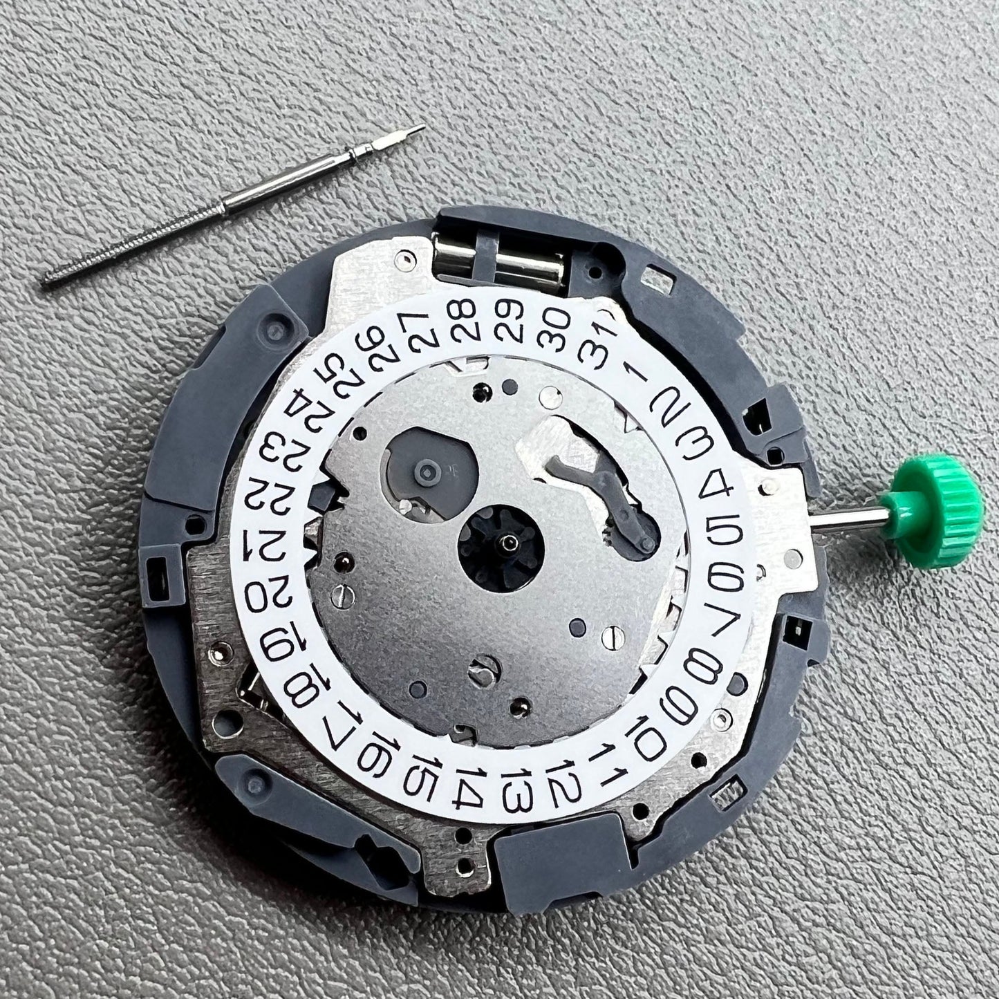 Japan Miyota OS10 quartz watch movement with date display at 3 o'clock, precision timekeeping accessory.