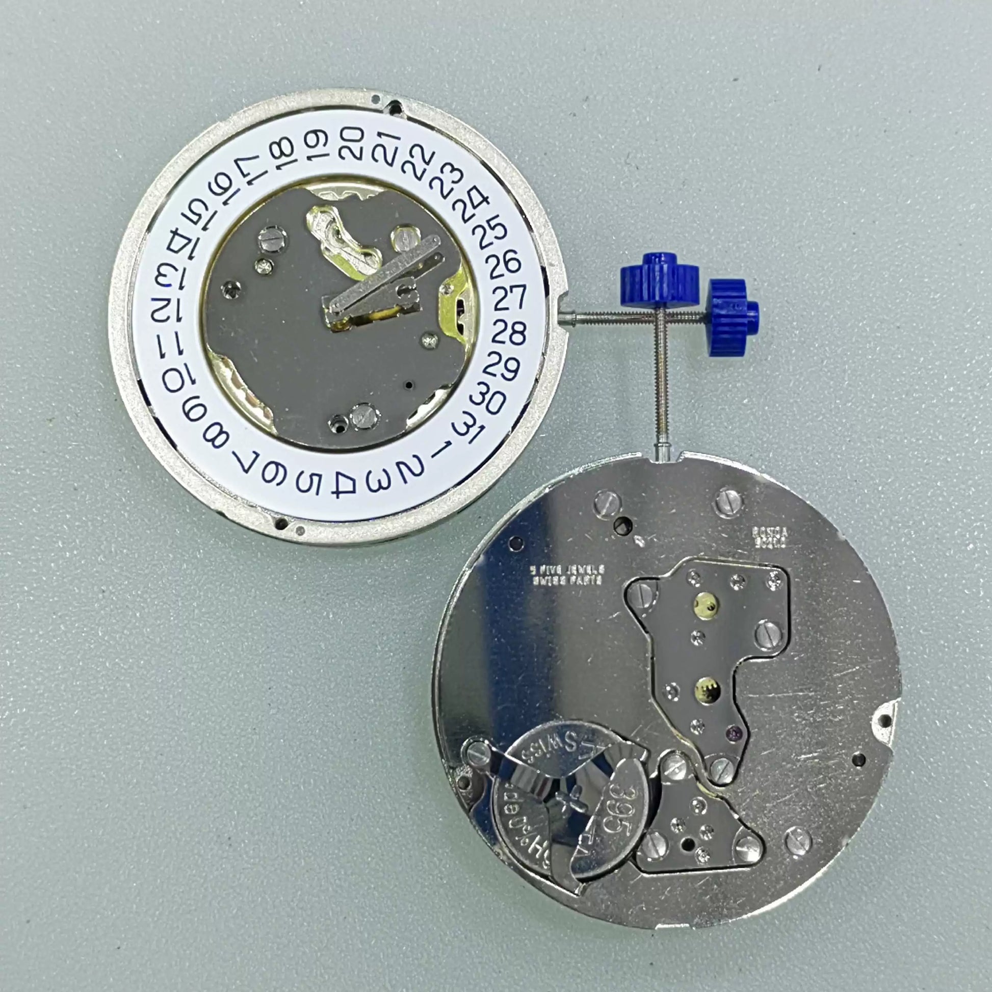 Swiss Part Ronda 5021.D quartz movement with date window at 4 o'clock, white dial disk.