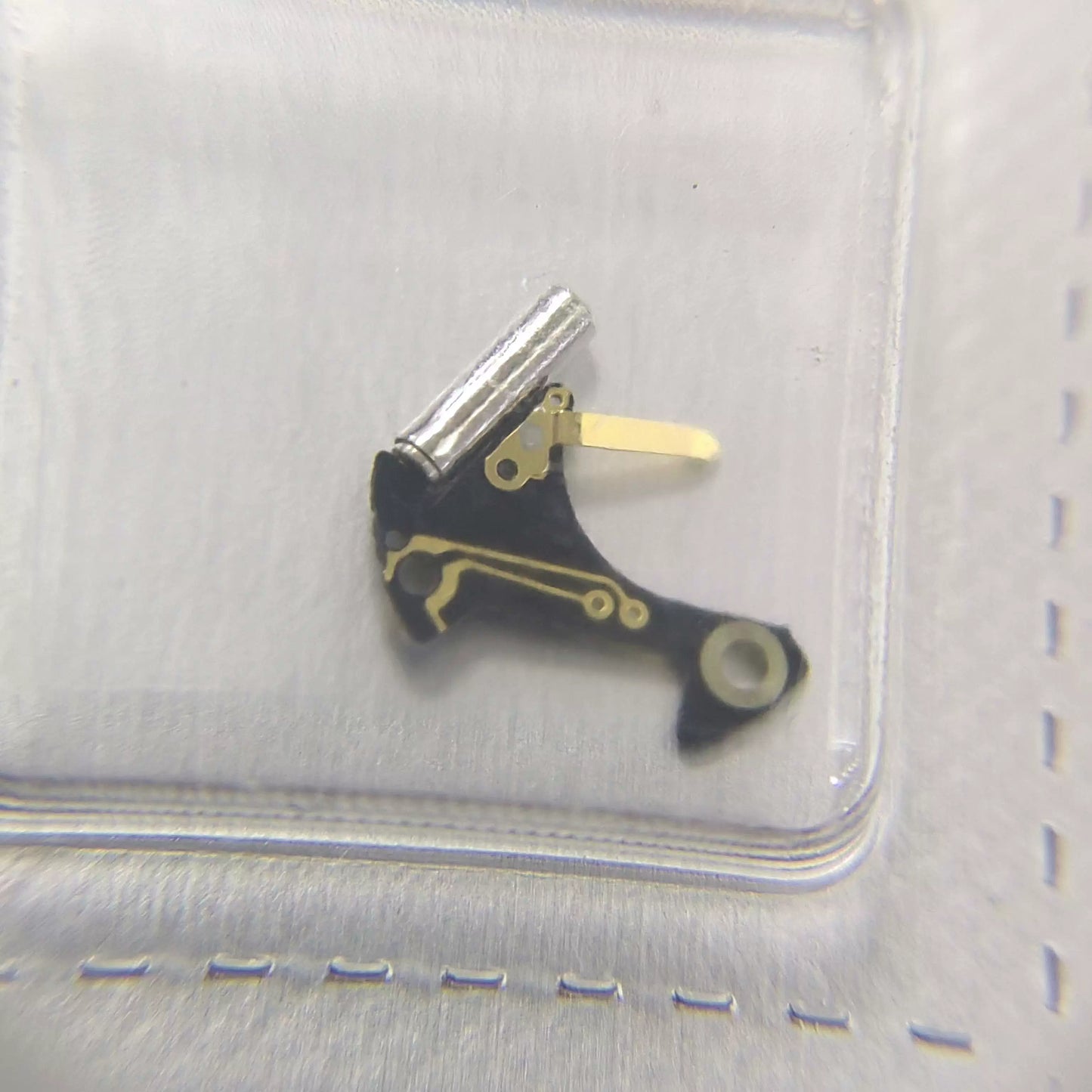 Swiss Made Ronda 1042 circuit board for precise watch repair and movement restoration.