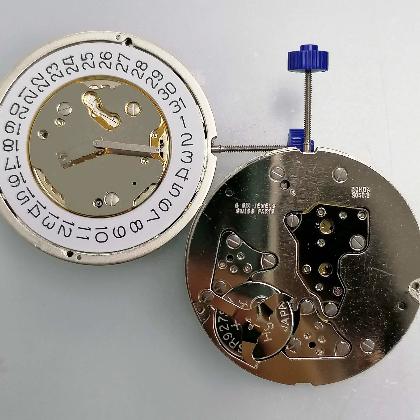Swiss Part Ronda 5040.D quartz watch movement with date at 4 o'clock, ideal for precision repairs.