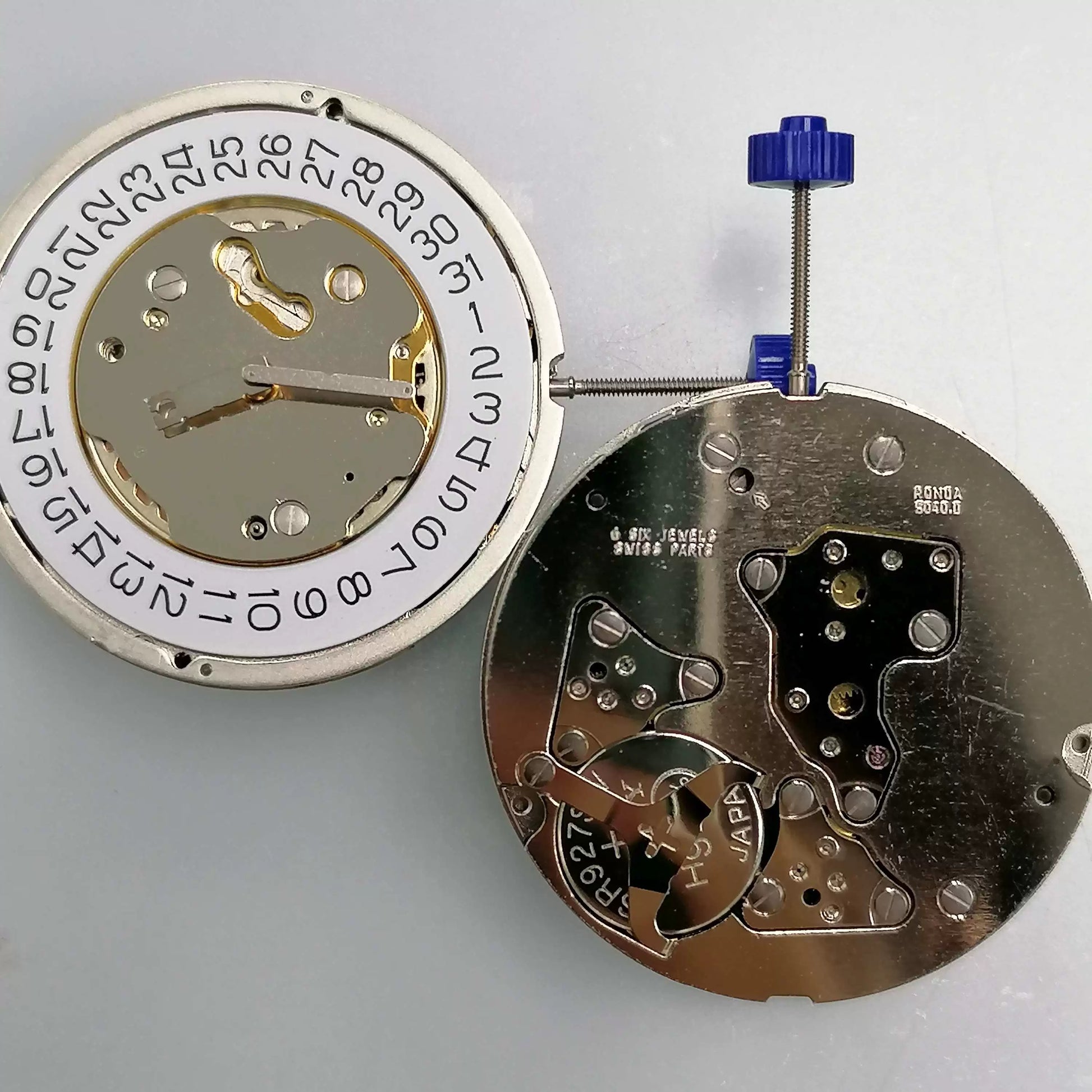 Swiss Part Ronda 5040.D quartz watch movement with date at 4 o'clock, ideal for precision repairs.