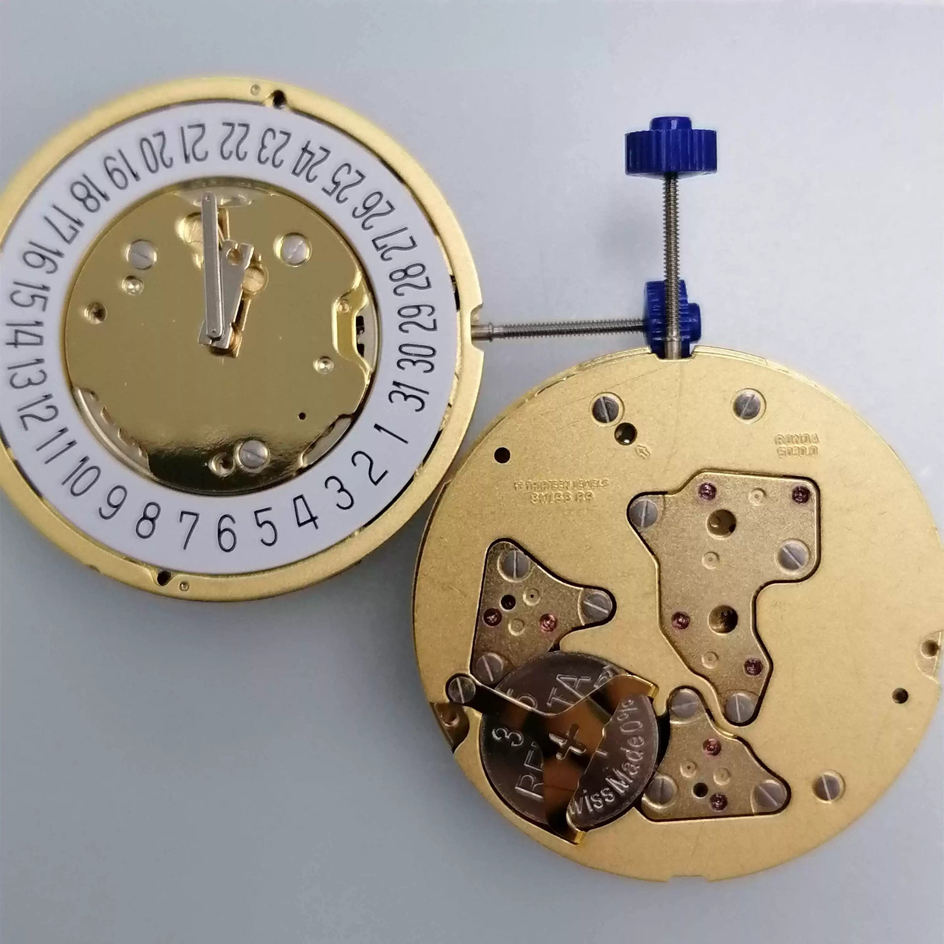 Swiss Made Ronda 5030.D quartz movement with date at 6 on white dial, precise watch accessory.