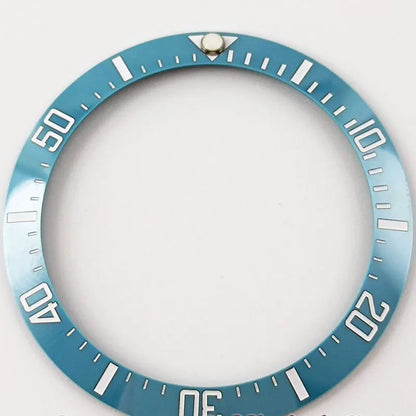 Blue ceramic bezel insert with white Arabic numerals for SUB GMT 38mm diver watch.