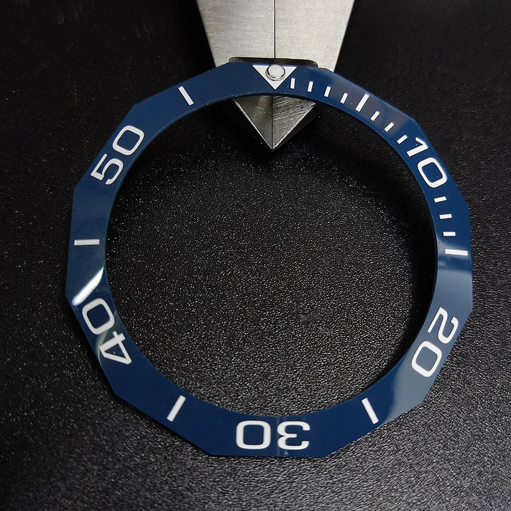 Sloping luminous ceramic bezel insert 42.3x33.3mm for automatic watch replacement, precise fit and durability.