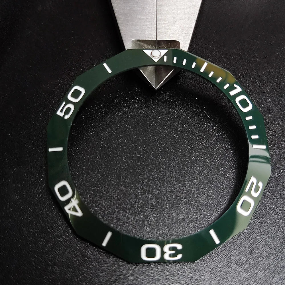 Sloping luminous ceramic bezel insert 42.3x33.3mm for automatic watch replacement, precise fit and durability.