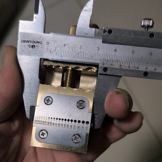 Copper watch repair tool with pointer tube clamp and manual vise for precise desktop watch fixing.