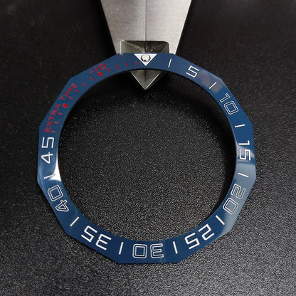 Sloping luminous ceramic bezel insert 42.3x33.3mm for automatic watch replacement, precise fit and durability.