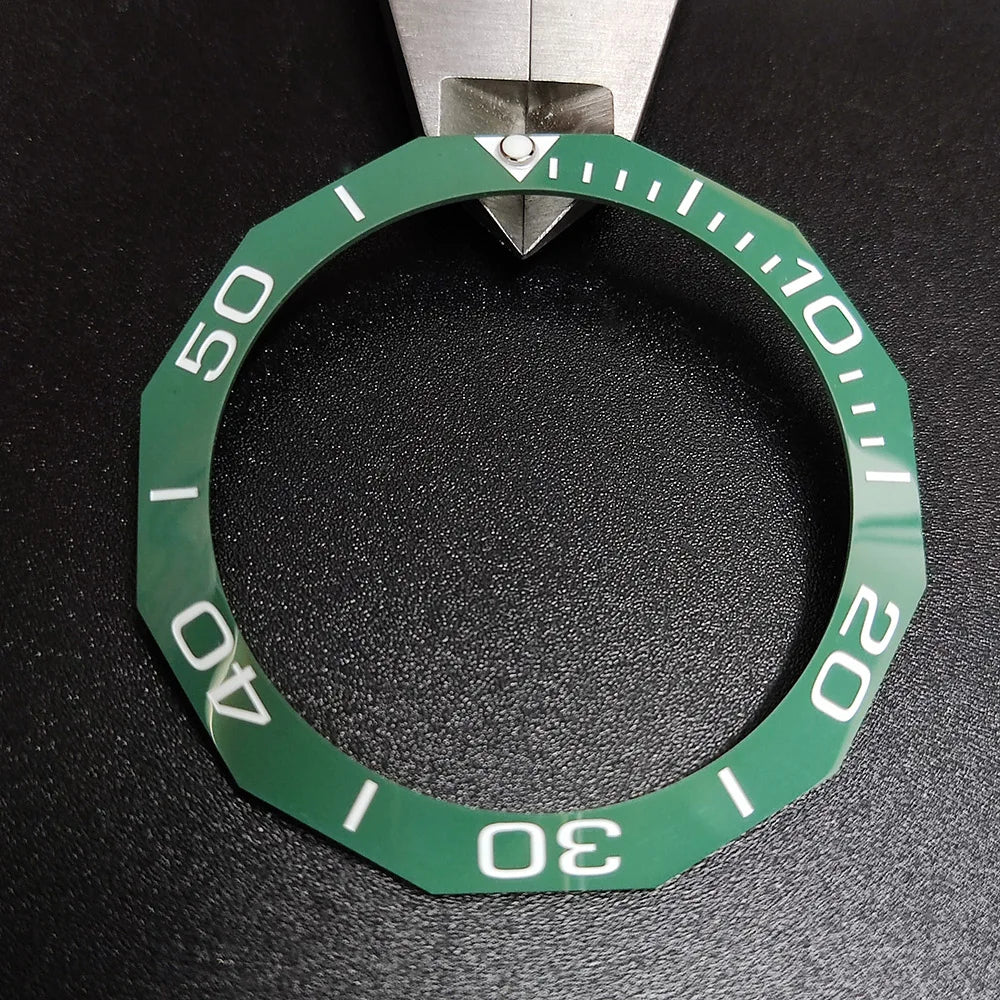 Sloping luminous ceramic bezel insert 42.3x33.3mm for automatic watch replacement, precise fit and durability.