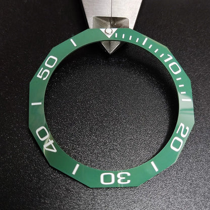 Sloping luminous ceramic bezel insert 42.3x33.3mm for automatic watch replacement, precise fit and durability.