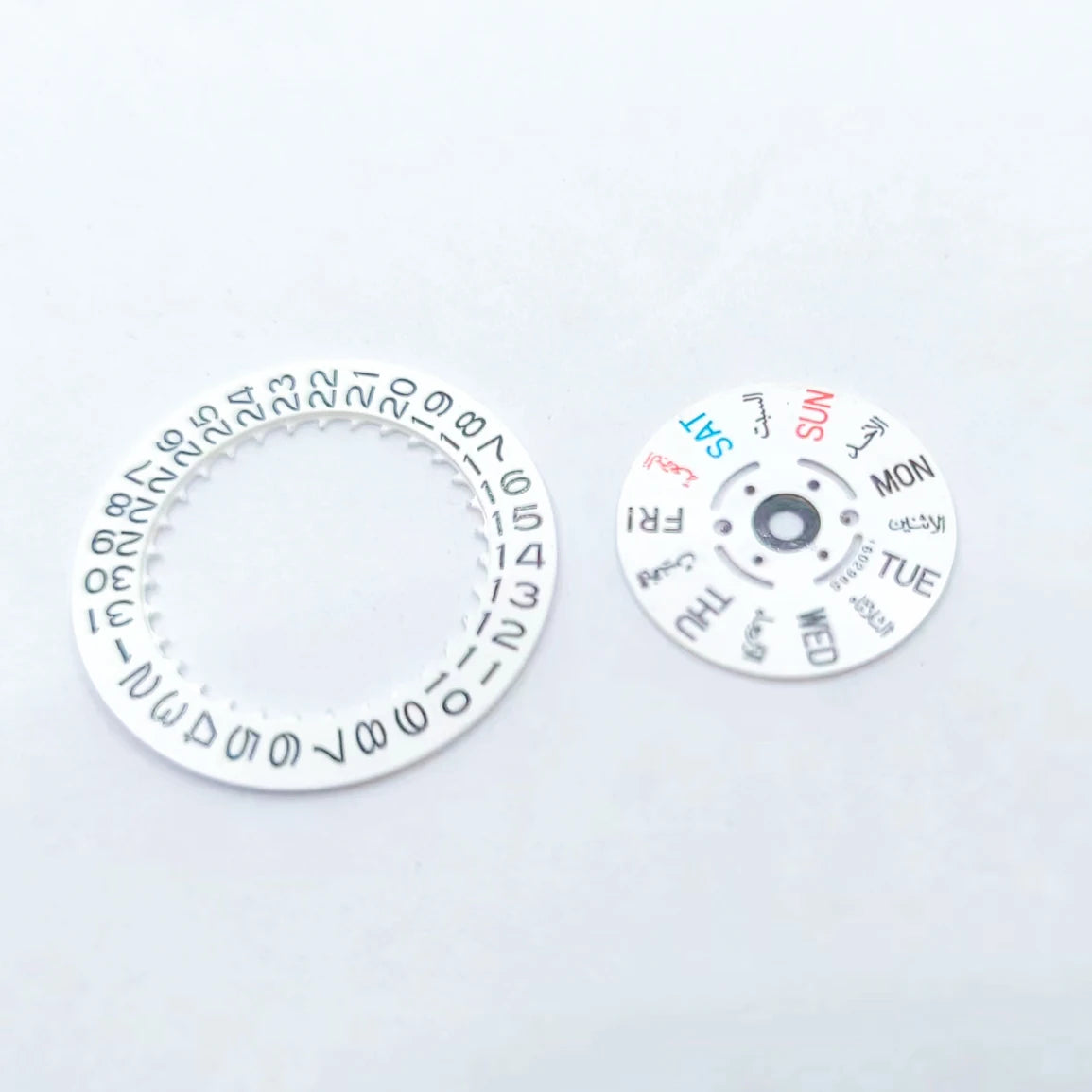 Set of calendar date and day wheel discs for 7S26 watch movement replacement, precise timing parts.