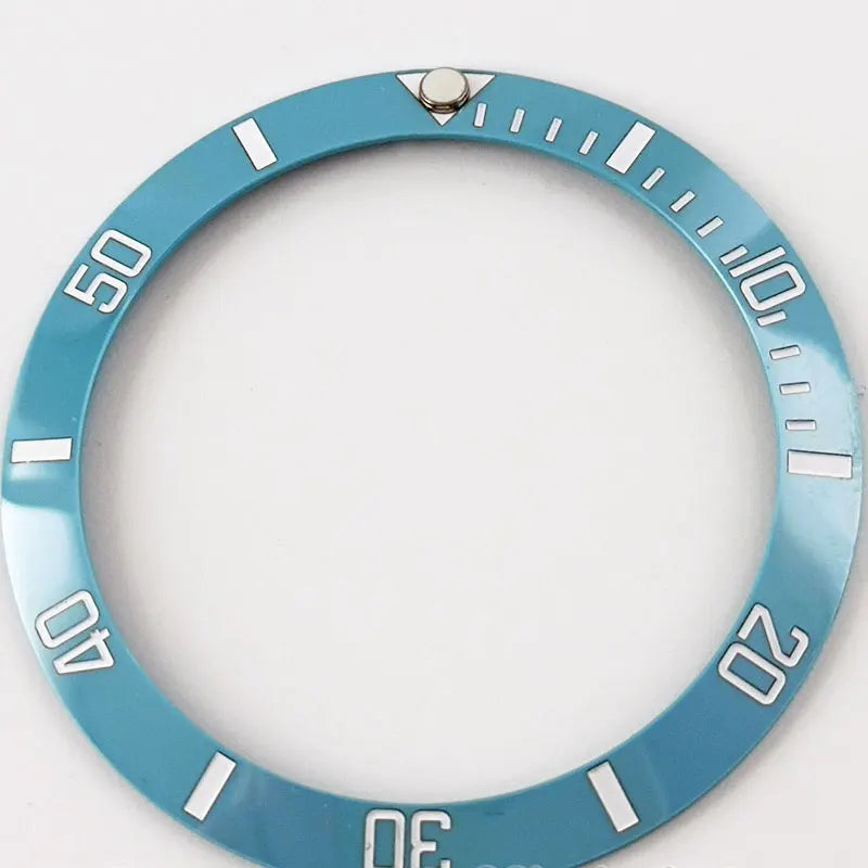 Blue ceramic bezel insert with white Arabic numerals for SUB GMT 38mm diver watch.