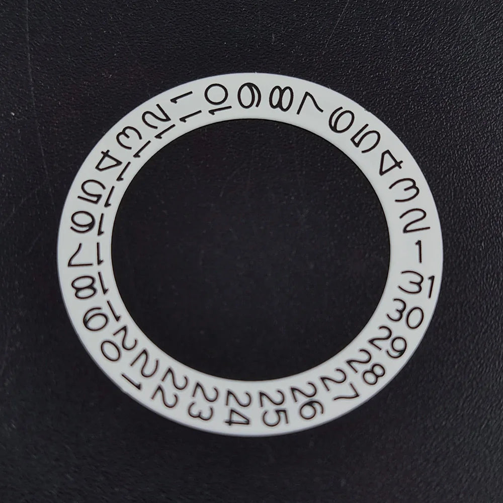 NH 35 watch calendar movement replacement parts with date and day wheel discs.