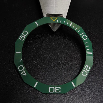Sloping luminous ceramic bezel insert 42.3x33.3mm for automatic watch replacement, precise fit and durability.