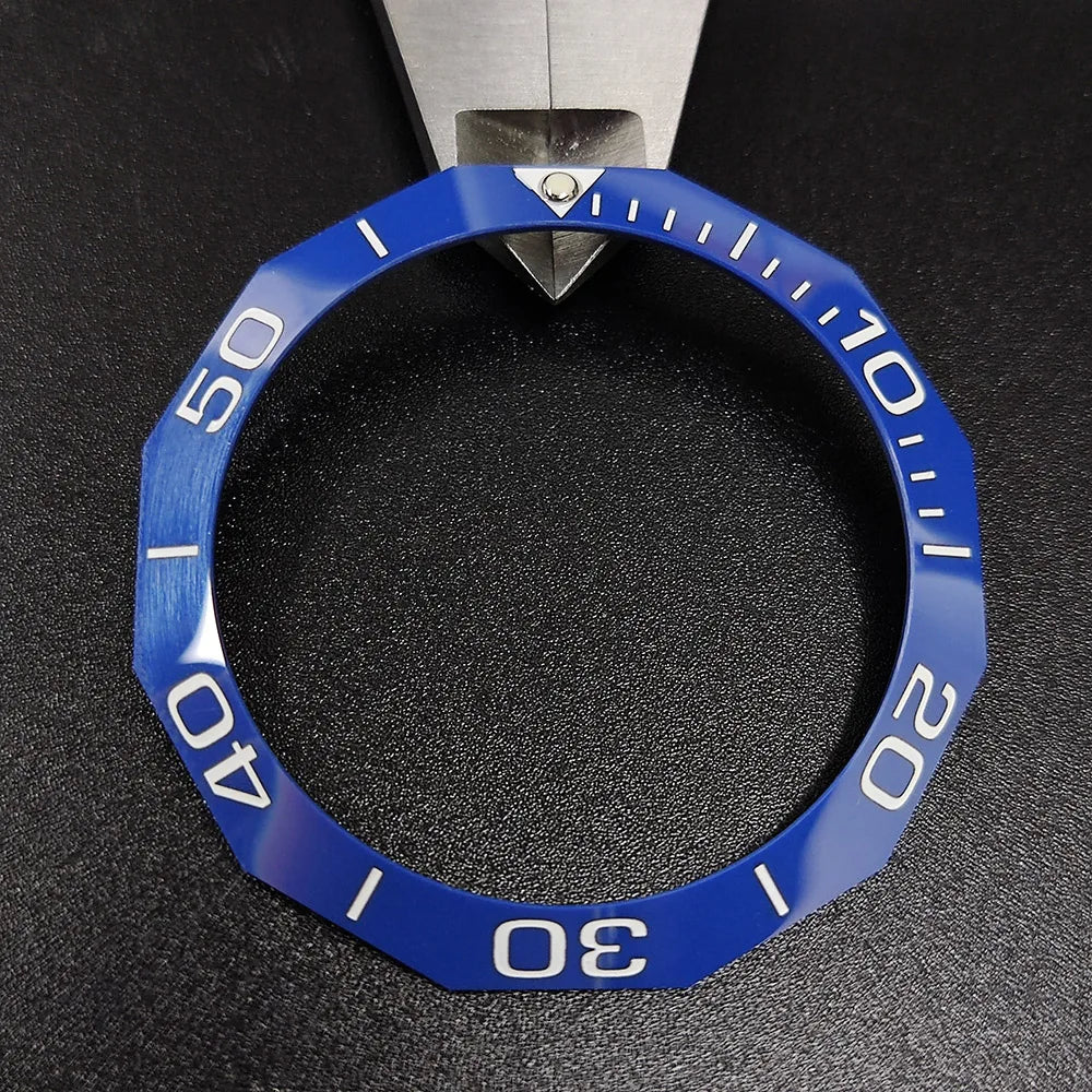 Sloping luminous ceramic bezel insert 42.3x33.3mm for automatic watch replacement, precise fit and durability.