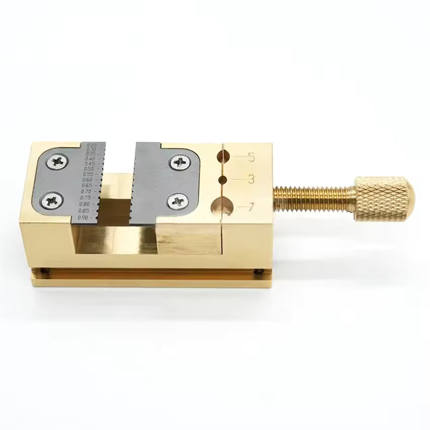 Copper Pointer Tube Clamp manual vise for precise watch repair on desktop, ideal for detailed watch accessory fixes.
