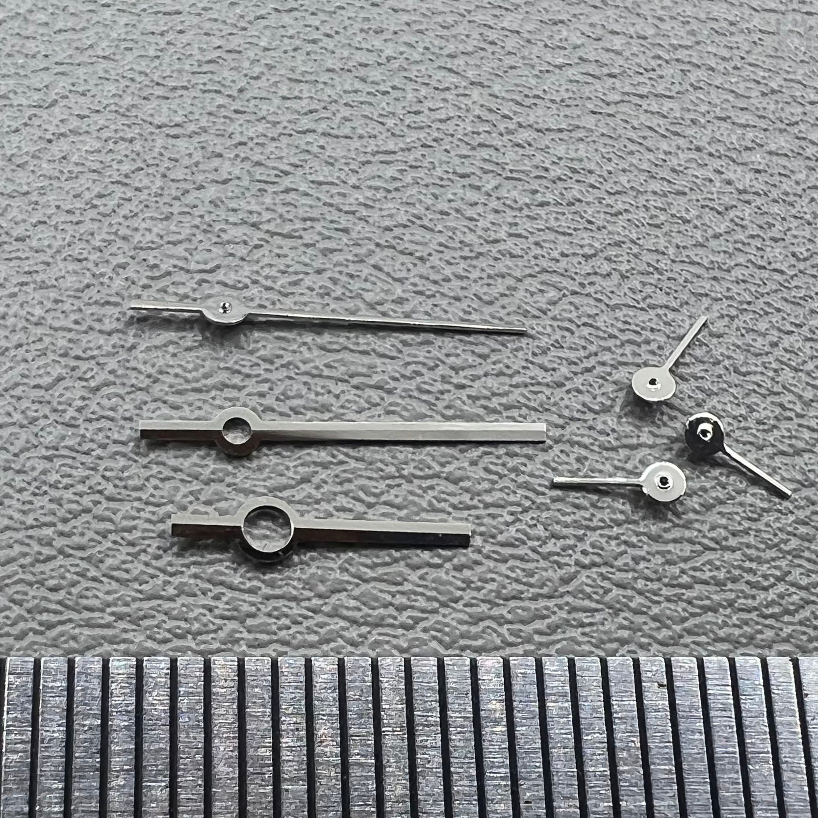 Silver watch hands set for Ronda 5030.D quartz movement, precision timepiece parts.