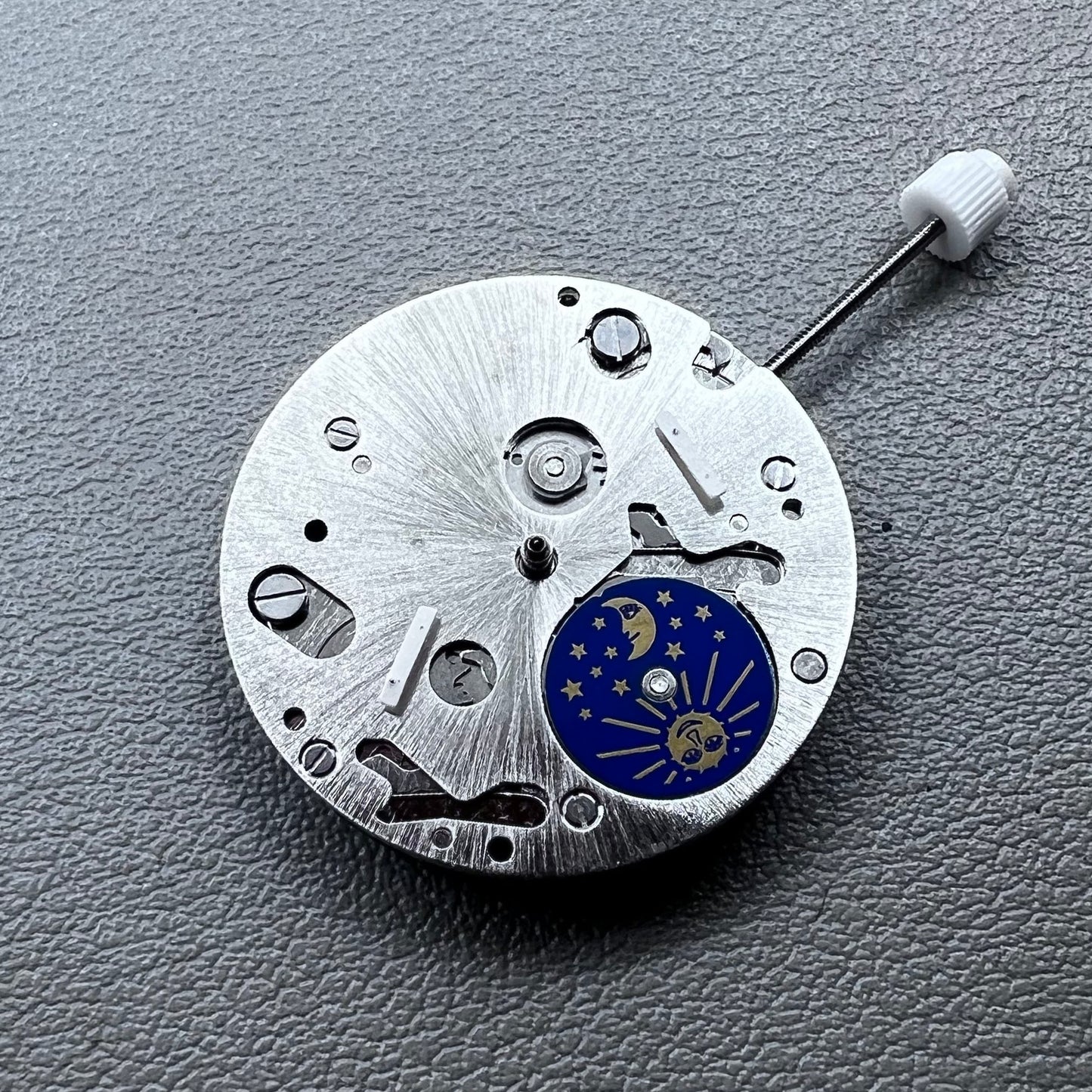Swiss ISA 9231 Quartz watch movement with star moon phase display at 6 o'clock, precision craftsmanship.
