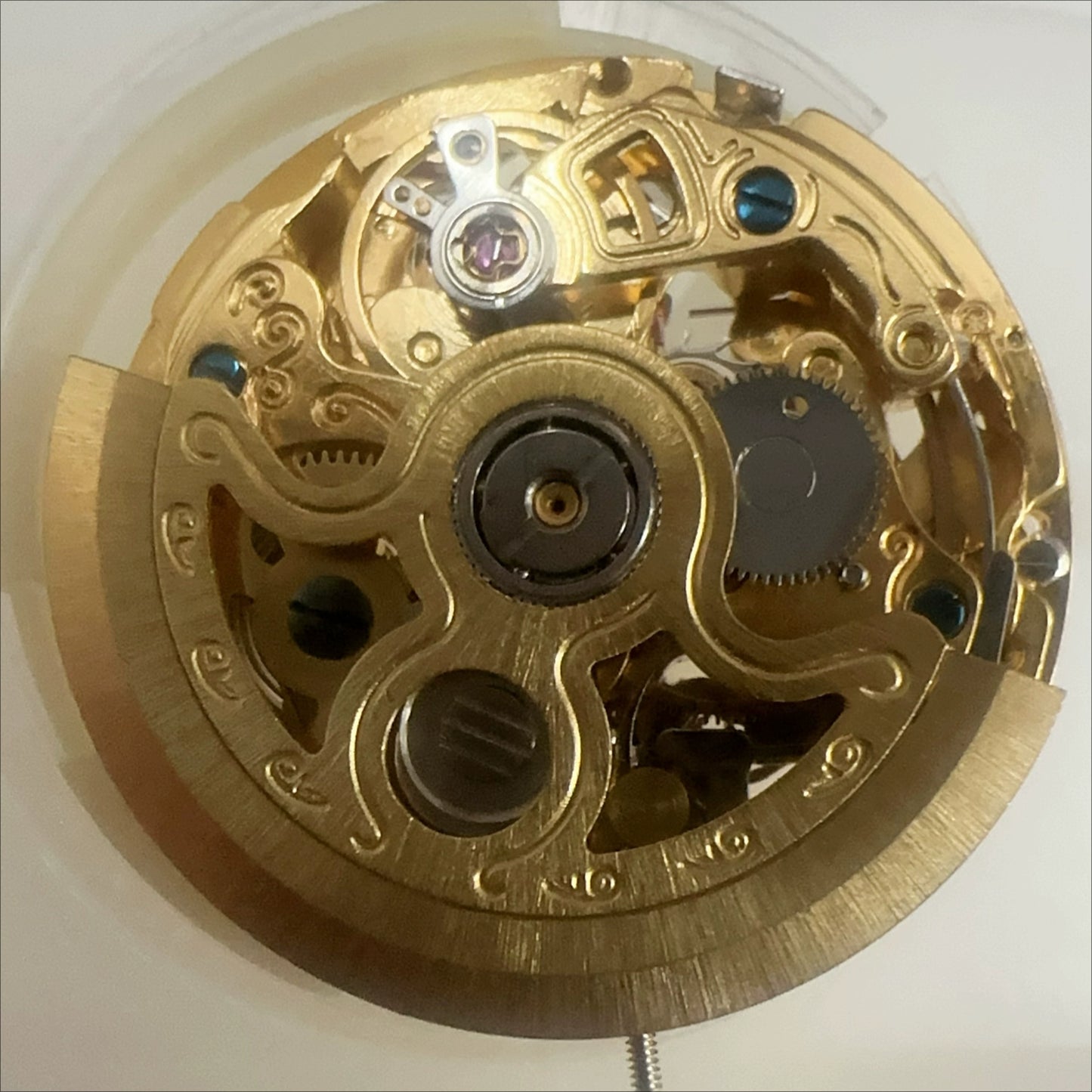 China Hangzhou 2189 automatic mechanical watch movement with 7 hands, hollow golden design for watch accessories.