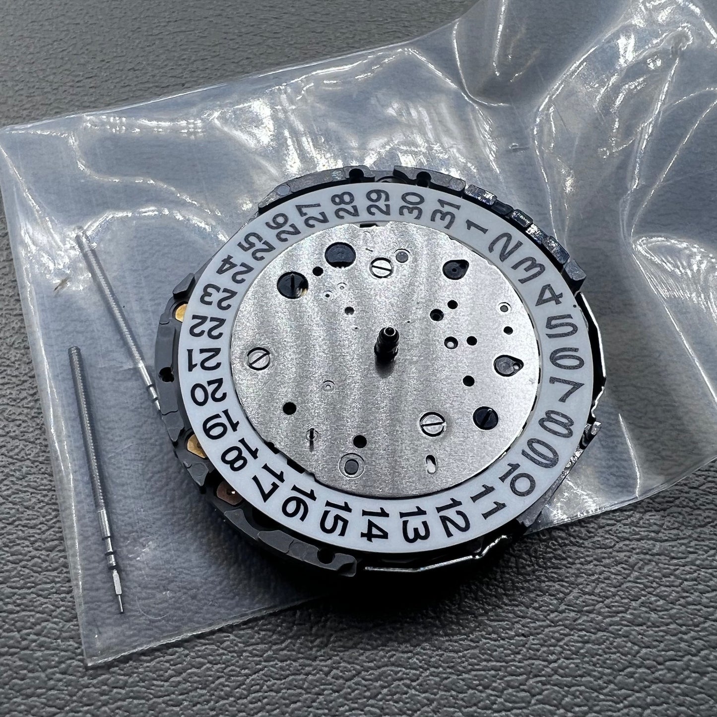Japan Miyota JS26 watch quartz movement with date at 3 o'clock and small seconds at 6 and 9 markers