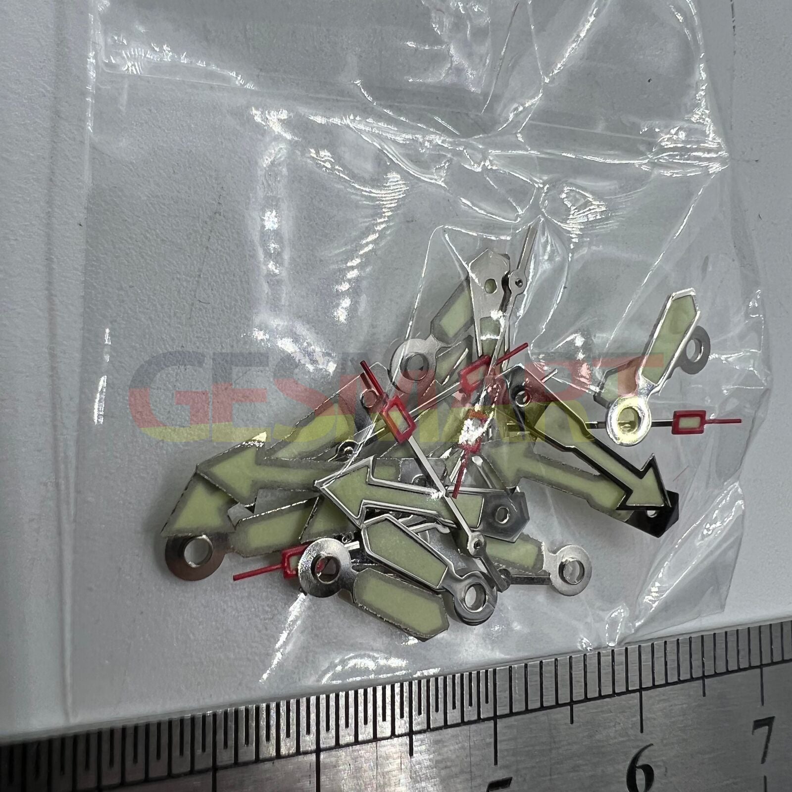 Arrow-shaped silver watch hand with green lume, compatible with Miyota 2035, 2115, 2105, 2305 movements.