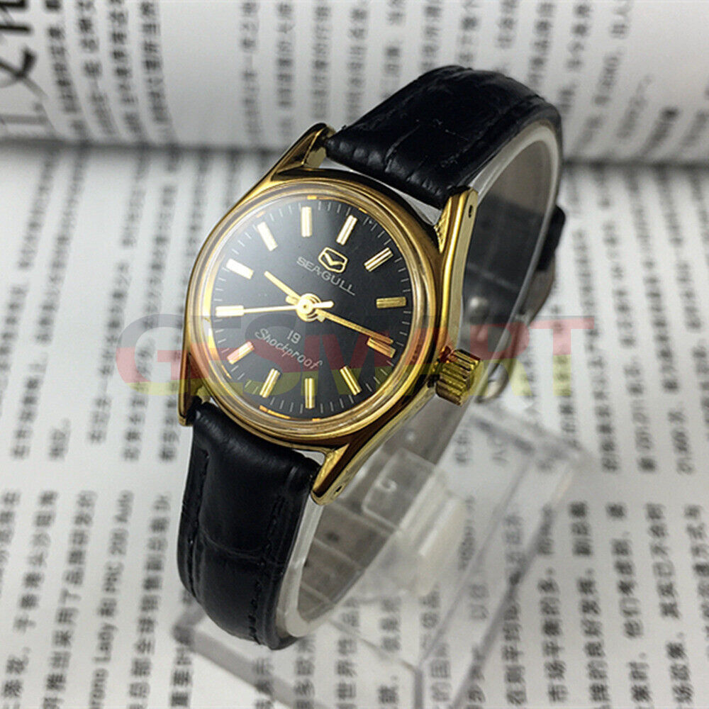 Black round case Tianjin Seagull ladies watch with gold nail markers and manual mechanical movement.
