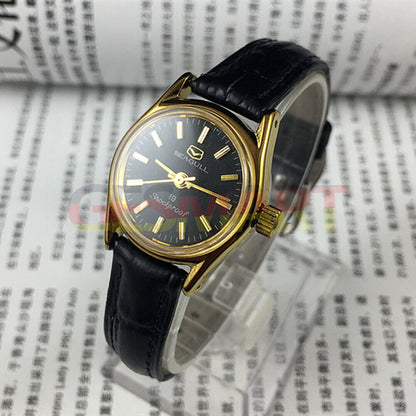 Black round case Tianjin Seagull ladies watch with gold nail markers and manual mechanical movement.