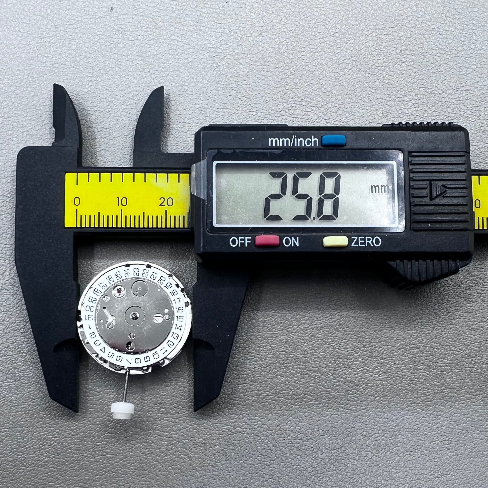 Silver plated DG2813 automatic watch movement with large and small hands, date display at 3 o'clock