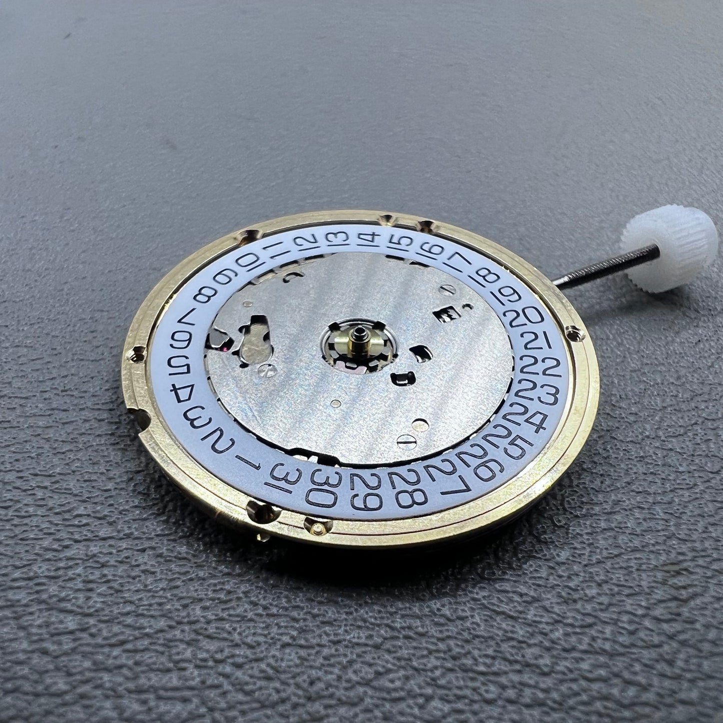 Swiss ETA E63.111 quartz watch movement with 3 hands and date display at 3 o?clock for precise timekeeping.