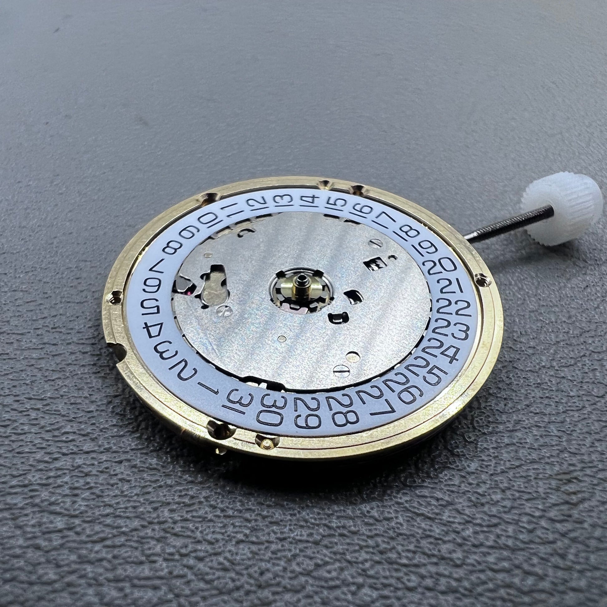 Swiss ETA E63.111 quartz watch movement with 3 hands and date display at 3 o?clock for precise timekeeping.