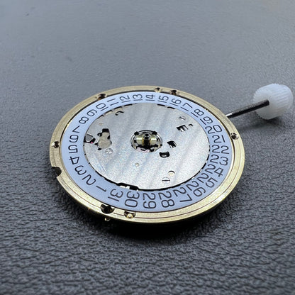 Swiss ETA E63.111 quartz watch movement with 3 hands and date display at 3 o?clock for precise timekeeping.