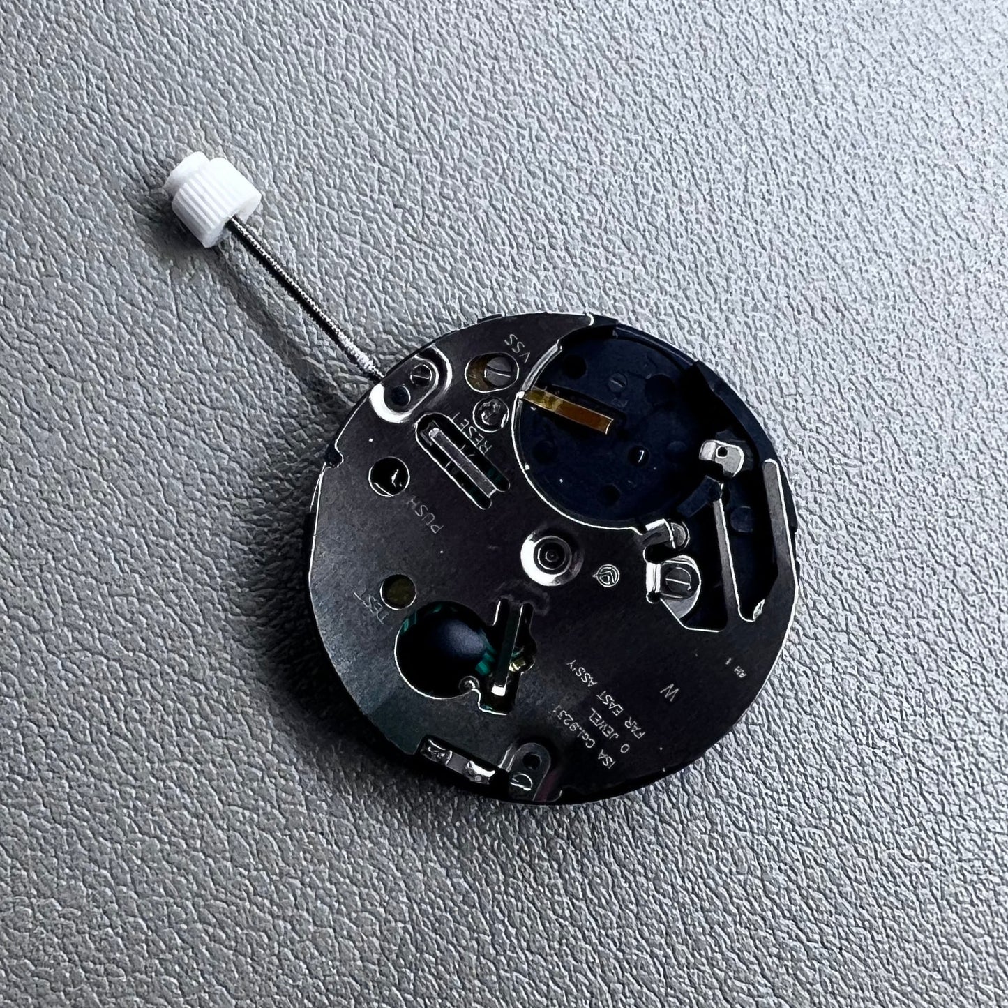 Swiss ISA 9231 Quartz watch movement with star moon phase display at 6 o'clock, precision craftsmanship.