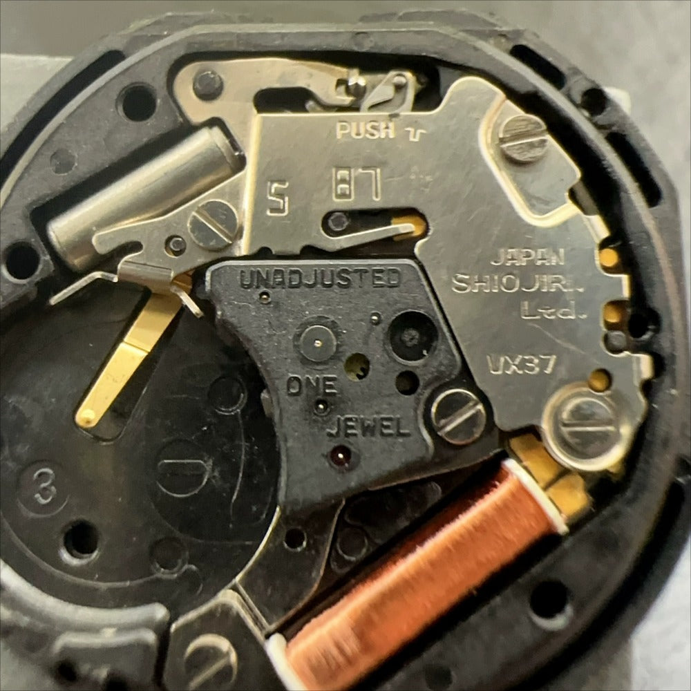 Japan-made VX37 quartz watch part, 3-hand movement for precise timekeeping and repair.